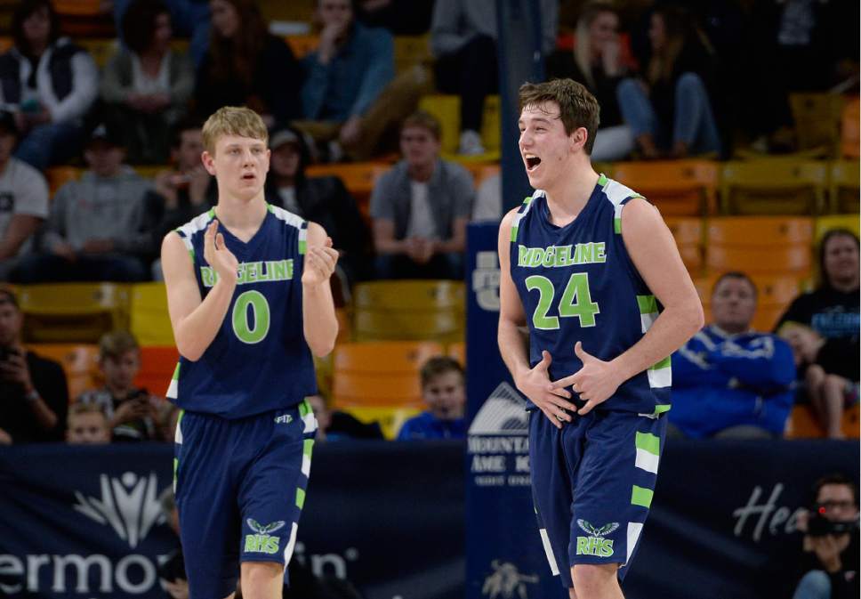 Scott Sommerdorf | The Salt Lake Tribune 
Dallan Larsen, left, and Theron Wallentine celebrate at the buzzer as Ridgeline beat Desert Hills 64-60 in a Boy's 3A semi-final playoff played at USU, Friday, February 24, 2017.