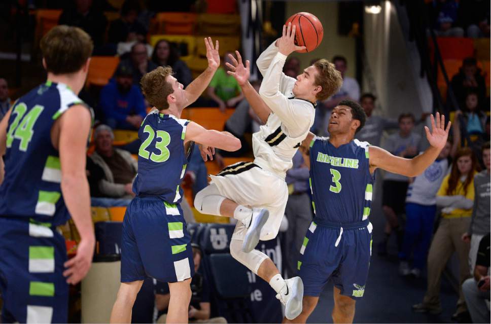 Scott Sommerdorf | The Salt Lake Tribune 
Logan Hokanson drives the paint against Jaxon Brenchley and Levani Damuni, right, during second half play. Ridgeline beat Desert Hills 64-60 in a Boy's 3A semi-final playoff played at USU, Friday, February 24, 2017.