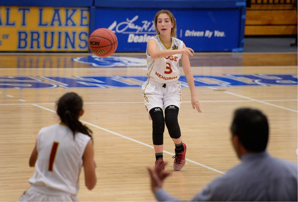 Scott Sommerdorf | The Salt Lake Tribune 
Haley Auer makes a pass late in the game. She would later hit a buzzer beater to help Judge Memorial beat East 45-43 in a girl's 4A playoff game played at SLCC, Thursday, February 23, 2017.