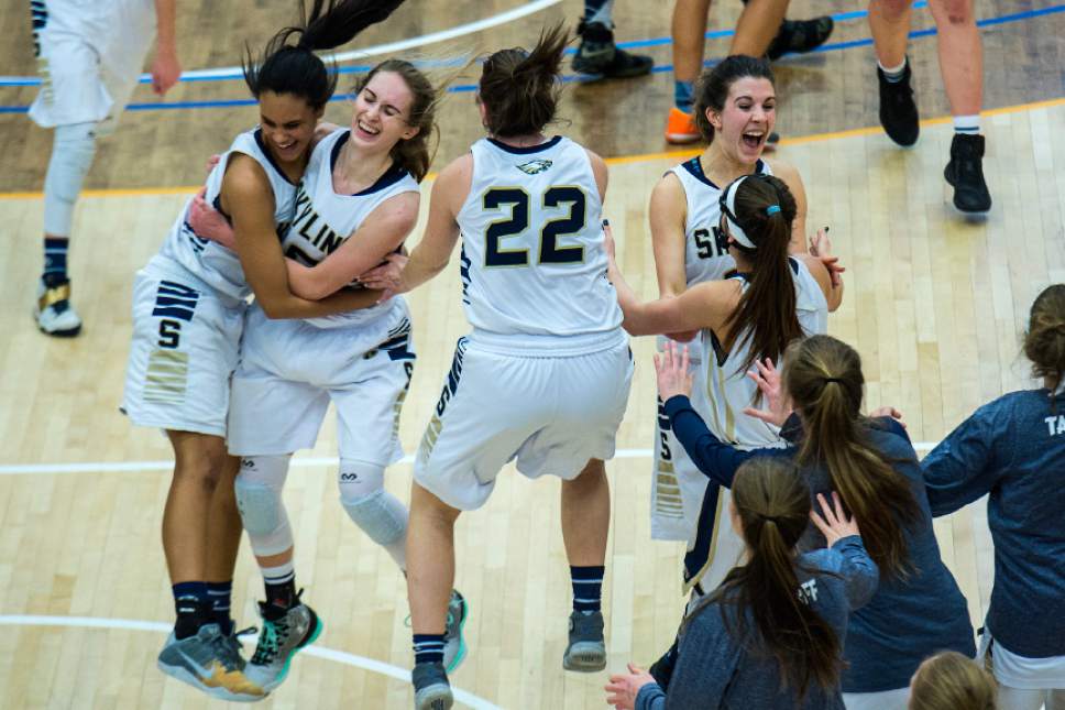 Chris Detrick  |  The Salt Lake Tribune
Skyline's Kiana Eskelson (3) Hannah Ander (15) Annabelle Peterson (22) Emma Clark (14) and Amit Lustgarten (1) celebrate after the 4A semifinal basketball game at Salt Lake Community College Friday February 24, 2017. Skyline defeated Timpview 52-45.