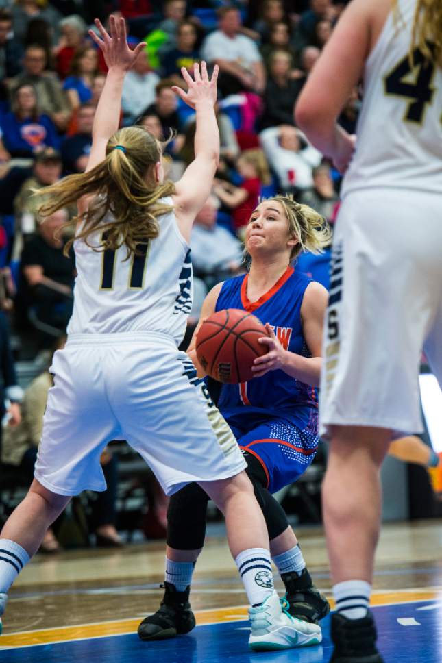 Chris Detrick  |  The Salt Lake Tribune
Skyline's Grace Helm (11) blocks Timpview's Kealani Neves (1) during the 4A semifinal basketball game at Salt Lake Community College Friday February 24, 2017. Skyline defeated Timpview 52-45.
