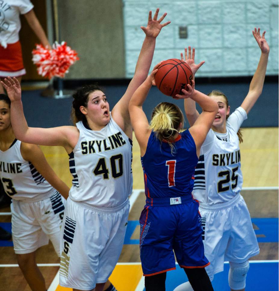 Chris Detrick  |  The Salt Lake Tribune
Skyline's Cameron Mooney (40) and Skyline's Madison Grange (25) block Timpview's Kealani Neves (1) during the 4A semifinal basketball game at Salt Lake Community College Friday February 24, 2017. Skyline defeated Timpview 52-45.