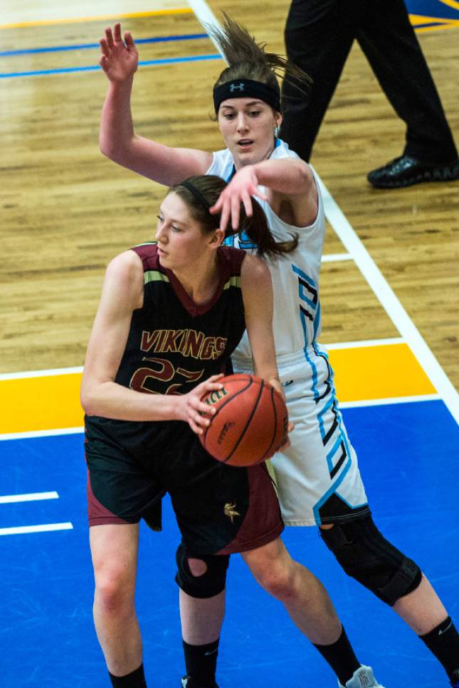 Chris Detrick  |  The Salt Lake Tribune
Viewmont's Megan Carr (22) grabs a rebound past Sky View's Hunter Krebs (42) during the 5A semifinal basketball game at Salt Lake Community College Friday February 24, 2017. Viewmont defeated Sky View 49-47.