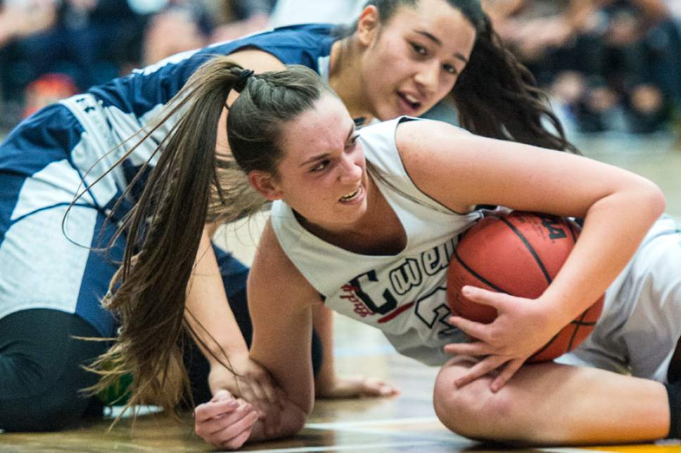 Chris Detrick  |  The Salt Lake Tribune
Copper Hills's Lenisi Fineanganofo (24) and American Fork's Savana Stephenson (3) fight for the ball during the 5A semifinal basketball game at Salt Lake Community College Friday February 24, 2017. American Fork defeated Copper Hills 48-45.
