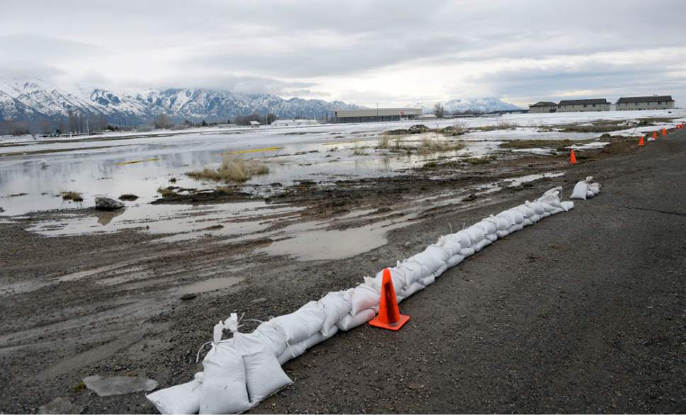 Al Hartmann  |  The Salt Lake Tribune
Standing water collects in field near the fairgrounds in Tremonton Monday Feb. 20.  Parts of Box Elder County have seen surface flooding due to the rapid snow melt dnd rain over the weekend and rain.  Main Street in Tremonton from 1000 to 2000 West was closed last night to pump out the area but is now open.