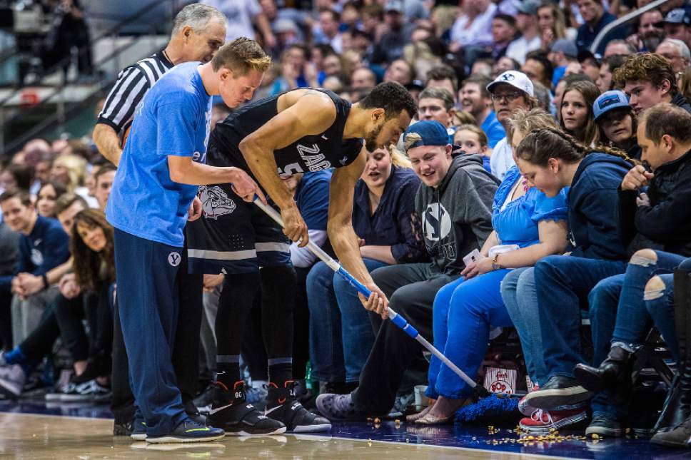 Chris Detrick  |  The Salt Lake Tribune
Gonzaga Bulldogs guard Nigel Williams-Goss (5) helps clean up popcorn spilled onto the court by a Brigham Young Cougar fan during the game at the Marriott Center Thursday February 2, 2017. Gonzaga Bulldogs defeated Brigham Young Cougars 85-75.