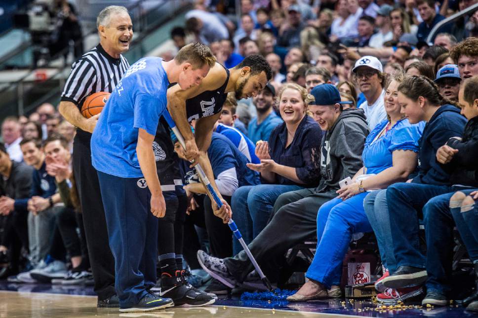Chris Detrick  |  The Salt Lake Tribune
Gonzaga Bulldogs guard Nigel Williams-Goss (5) helps clean up popcorn spilled onto the court by a Brigham Young Cougar fan during the game at the Marriott Center Thursday February 2, 2017. Gonzaga Bulldogs defeated Brigham Young Cougars 85-75.