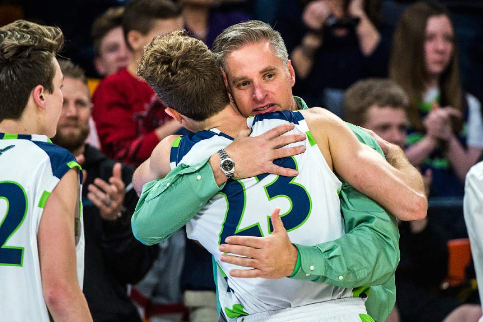 Chris Detrick  |  The Salt Lake Tribune
Ridgeline's Jaxon Brenchley (23) gets a hug from coach Graydon Buchmiller during the 3A boys' basketball state championship game at Dee Glen Smith Spectrum at Utah State University Saturday February 25, 2017. Ridgeline defeated Juan Diego 89-63.