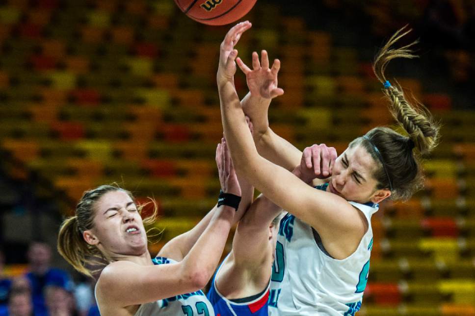 Chris Detrick  |  The Salt Lake Tribune
Juan Diego's Rebecca Curran (12) Richfield's Shandi Bastian (4) and Juan Diego's Kallie Craig (20) go for the ball during the 3A girls' basketball state championship game at Dee Glen Smith Spectrum at Utah State University Saturday February 25, 2017. Juan Diego defeated Richfield 34-32.