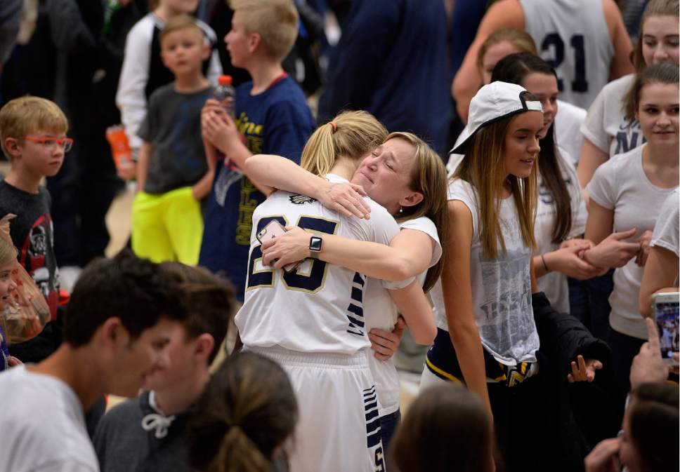 Scott Sommerdorf | The Salt Lake Tribune 
Angela Grange tearfully hugs her daughter Madison after the game was won by Grange's clutch free throws in OT. Skyline defeated Judge Memorial 60-57 in OT to take the Girl's 4A championship, Saturday, February 25, 2017.