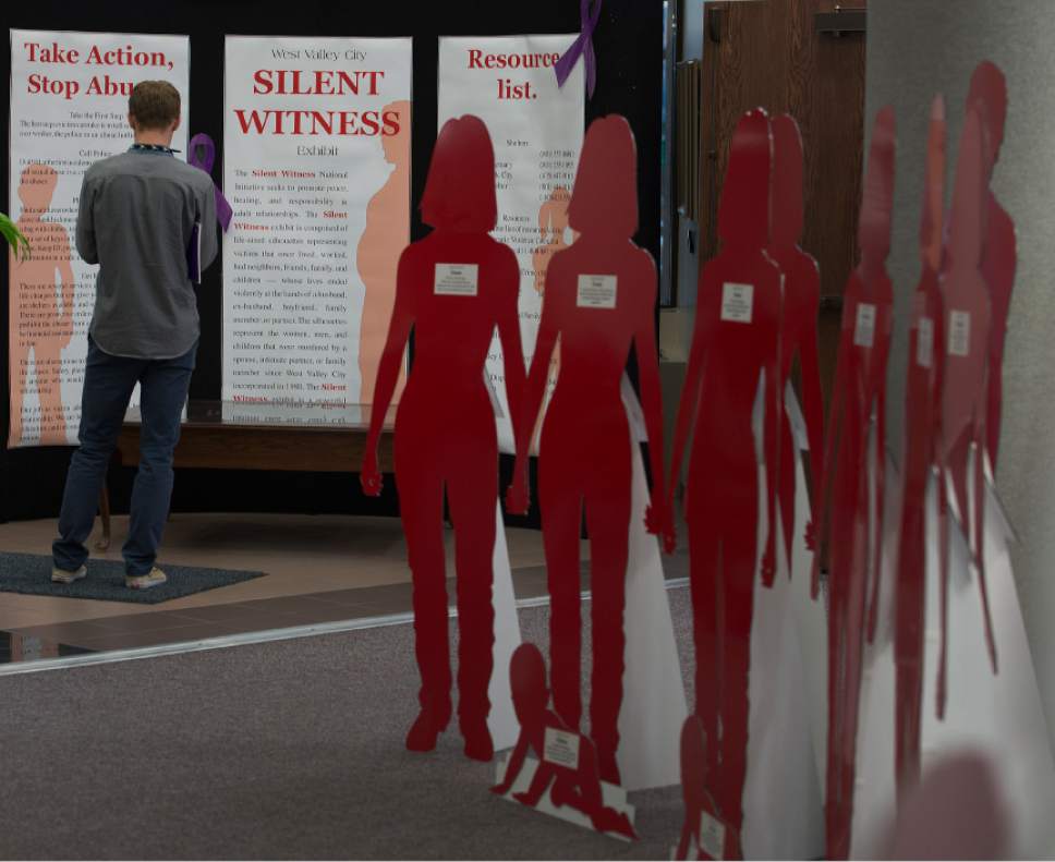 Leah Hogsten  |   Tribune file photo
Red and white silhouette cut-outs filled the lobby of West Valley City Hall last October, representing victims of domestic violence and their stories. The month of October is Domestic Violence Awareness Month and the West Valley City Police Department hopes to increase awareness about domestic violence.