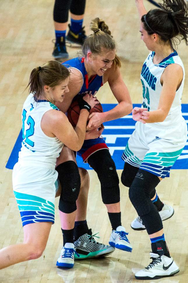 Chris Detrick  |  The Salt Lake Tribune
Juan Diego's Rebecca Curran (12) Richfield's Caitlyn Nabity (11) and Juan Diego's Anna Ewoniuk (34) fight for the ball during the 3A girls' basketball state championship game at Dee Glen Smith Spectrum at Utah State University Saturday February 25, 2017.
