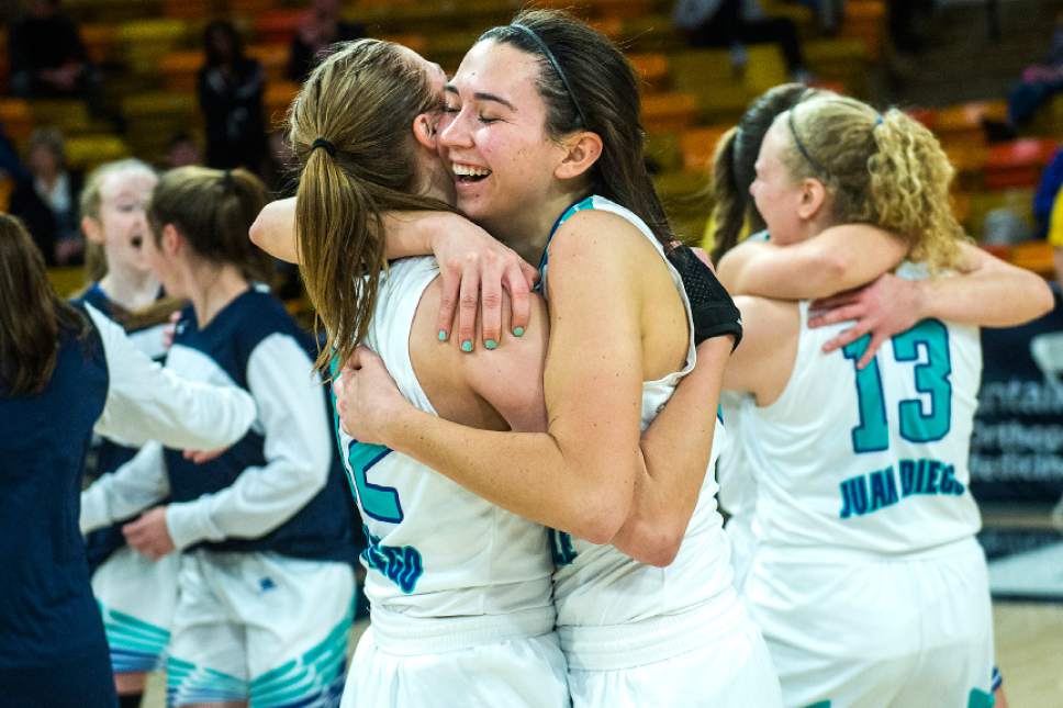Chris Detrick  |  The Salt Lake Tribune
Juan Diego's Rebecca Curran (12) and Anna Ewoniuk (34) celebrate after winning the 3A girls' basketball state championship game at Dee Glen Smith Spectrum at Utah State University Saturday February 25, 2017. Juan Diego defeated Richfield 34-32.