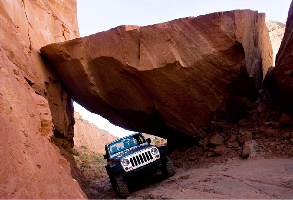 Tribune file photo 
Rob Covert drives a Jeep on Long Canyon Road near Moab in 2010.