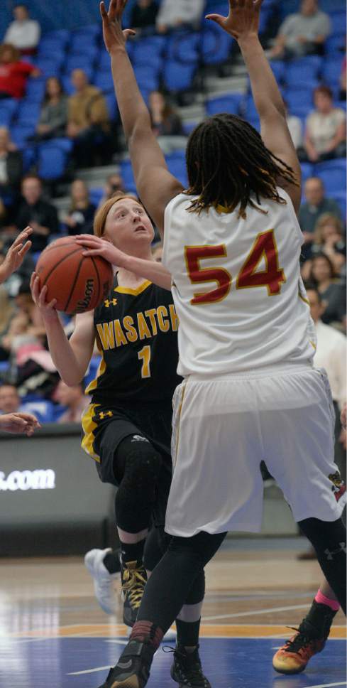 Al Hartmann  |  The Salt Lake Tribune
Wasatch High School's 5-1 guard Faith Fitzgerald is humbled by the size of Judge center Vanessa Austin in first round action in the 2017 4A Girls' State Basketball Championships game Tuesday Feb. 21.  Judge went on to edge Wasatch High School 35-32 to enter the quarterfinals.