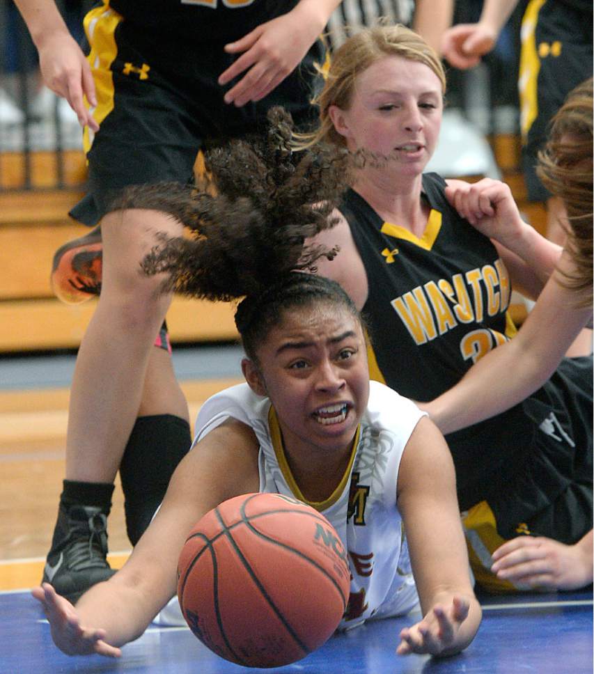 Al Hartmann  |  The Salt Lake Tribune
Judge High School's Miyalla Tarver scrambles for the ball with Wasatch's Kenzie Mcbride in first round action in the 2017 4A Girls' State Basketball Championships game Tuesday Feb. 21.  Judge went on to edge Wasatch High School 35-32 to enter the quarterfinals.