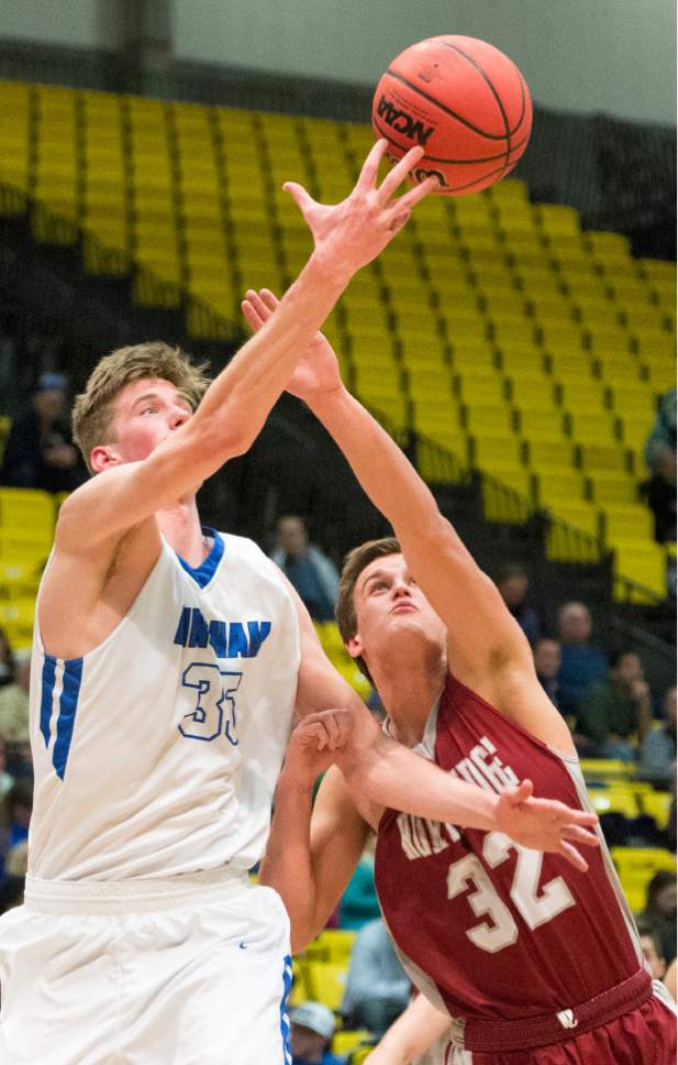 Rick Egan  |  The Salt Lake Tribune

Bingham center Branden Carlson (35) goes for the ball along with Northridge Knights Jackson Kohl (32), in State 5A basketball playoff action at UVU in Orem, Monday, February 27, 2017.