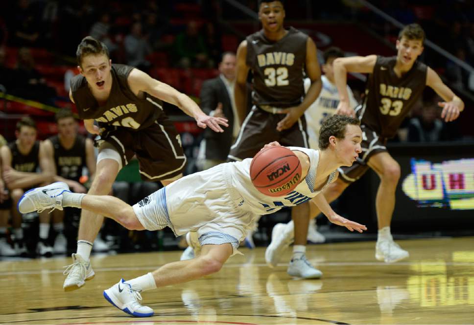 Francisco Kjolseth | The Salt Lake Tribune
David Peterson of Pleasant Grove loses his footing against Davis in the 5A boys' basketball playoff game at the Huntsman Center on the University of Utah campus on Monday, February 27, 2017.
