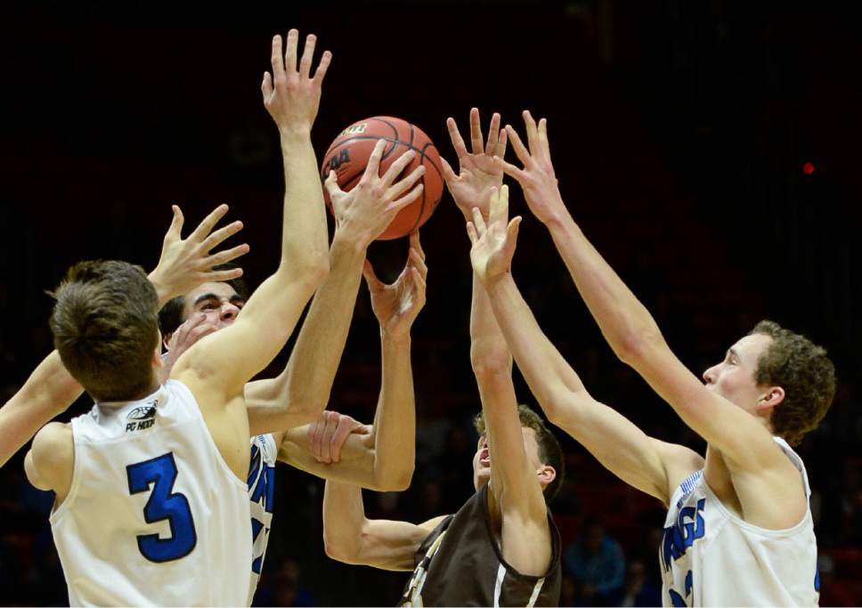 Francisco Kjolseth | The Salt Lake Tribune
Pleasant Grove battles Davis for a rebound in the 5A boys' basketball playoff game at the Huntsman Center on the University of Utah campus on Monday, February 27, 2017.