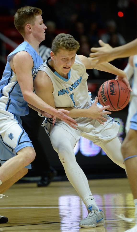Francisco Kjolseth | The Salt Lake Tribune
Sky View's Mason Falsely tries to push past the West Jordan defense in the 5A boys' basketball playoff game at the Huntsman Center on the University of Utah campus on Monday, February 27, 2017.