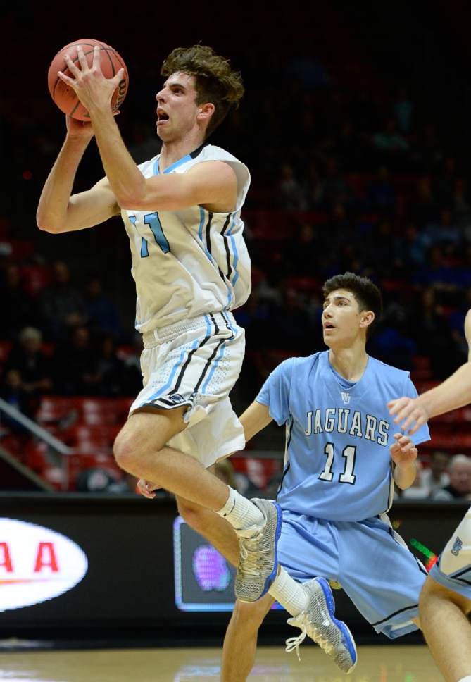 Francisco Kjolseth | The Salt Lake Tribune
Sky View's Luke White drives the ball to the basket past Connor Manglinong of West Jordan in the 5A boys' basketball playoff game at the Huntsman Center on the University of Utah campus on Monday, February 27, 2017.