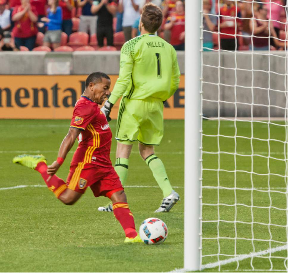 Michael Mangum  |  Special to the Tribune

Seattle Sounders goalkeeper Tyler Miller walks away in frustration as Real Salt Lake forward Joao Plata kicks the ball into the net in celebration following his penalty kick score during their U.S. Open Cup match at Rio Tinto Stadium in Sandy, UT on Tuesday, June 28th, 2016.