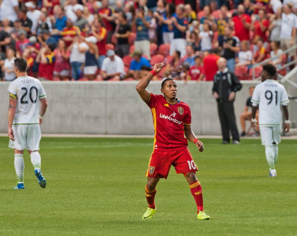 Michael Mangum  |  Special to the Tribune

Real Salt Lake forward Joao Plata celebrates his first-half penalty kick score as Seattle Sounders defenders Zach Scott (20) and Oniel Fisher (91) walk way during their U.S. Open Cup match at Rio Tinto Stadium in Sandy, UT on Tuesday, June 28th, 2016.