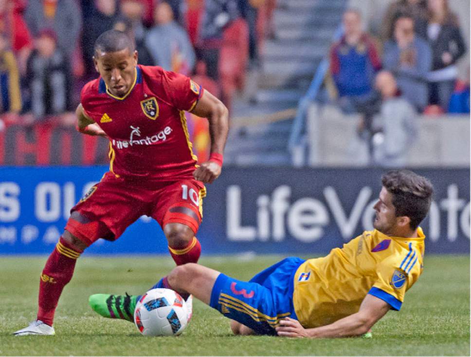 Michael Mangum  |  Special to the Tribune

Real Salt Lake forward Joao Plata (10) avoids a slide tackle from Colorado Rapids defender Eric Miller (3) during the first half their match at Rio Tinto Stadium in Sandy, UT on Saturday, April 9, 2016.