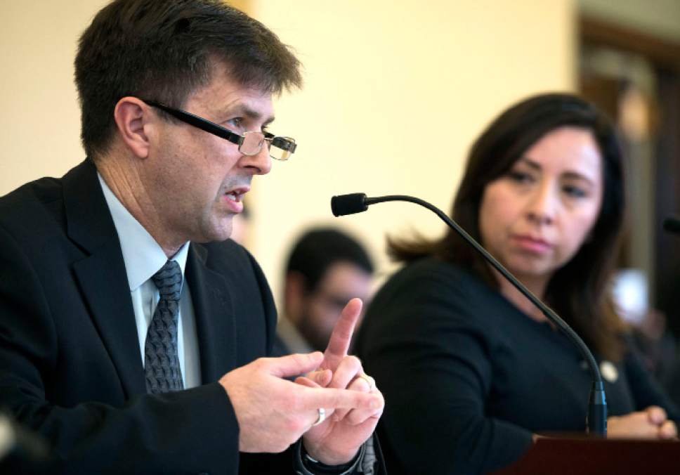 Steve Griffin  |  The Salt Lake Tribune


Utah State Crime Lab Director Jay Henry, testifies on HB200 during the Senate Judiciary Law Enforcement and Criminal Justice Standing Committee at the State Capitol in Salt Lake City Monday February 27, 2017. HB200 modifies provisions of the criminal code regarding the testing of sexual assault kits. The bill's sponsor, Rep. Angela Romero, D-Salt Lake, is at right.