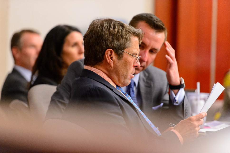 Trent Nelson  |  The Salt Lake Tribune
Defense attorneys Scott C. Williams and Brad Anderson confer during the John Swallow public-corruption trial in Salt Lake City, Tuesday February 28, 2017. At left is John Swallow and defense attorney Cara Tangaro.