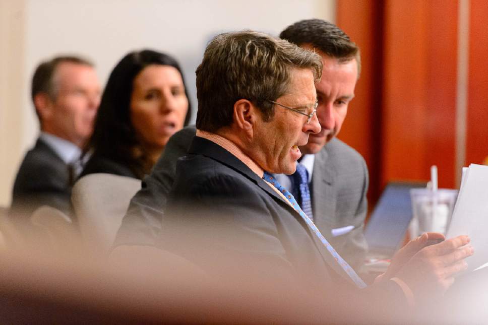 Trent Nelson  |  The Salt Lake Tribune
Defense attorneys Scott C. Williams and Brad Anderson confer during the John Swallow public-corruption trial in Salt Lake City, Tuesday February 28, 2017. At left is John Swallow and defense attorney Cara Tangaro.