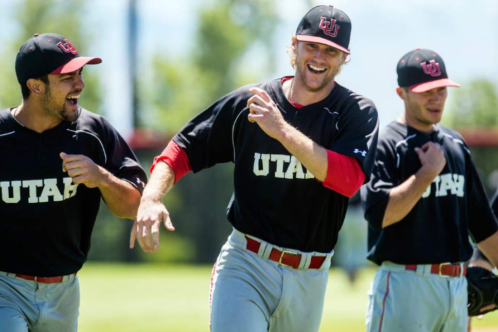 Chris Detrick  |  The Salt Lake Tribune
University of Utah baseball players Dallas Carroll, left, and Hunter Simmons joke around while warming up during a practice Wednesday May 11, 2016.