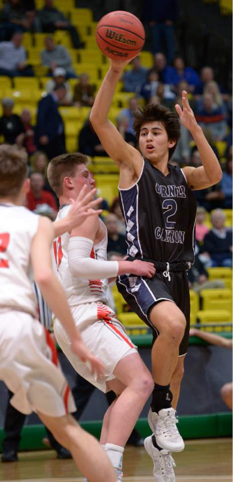 Leah Hogsten  |  The Salt Lake Tribune
Corner Canyon's John Mitchell looks for the pass. 
Corner Canyon High School defeated Bountiful High School 62-42 during their 4A State boys' basketball playoff game at the UCCU Center on Utah Valley University's campus, Tuesday, February 28, 2017.