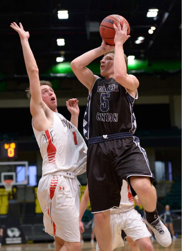 Leah Hogsten  |  The Salt Lake Tribune
Corner Canyon's Michael Schefner shoots around Bountiful's Cooper Parkinson. Corner Canyon High School defeated Bountiful High School 62-42 during their 4A State boys' basketball playoff game at the UCCU Center on Utah Valley University's campus, Tuesday, February 28, 2017.