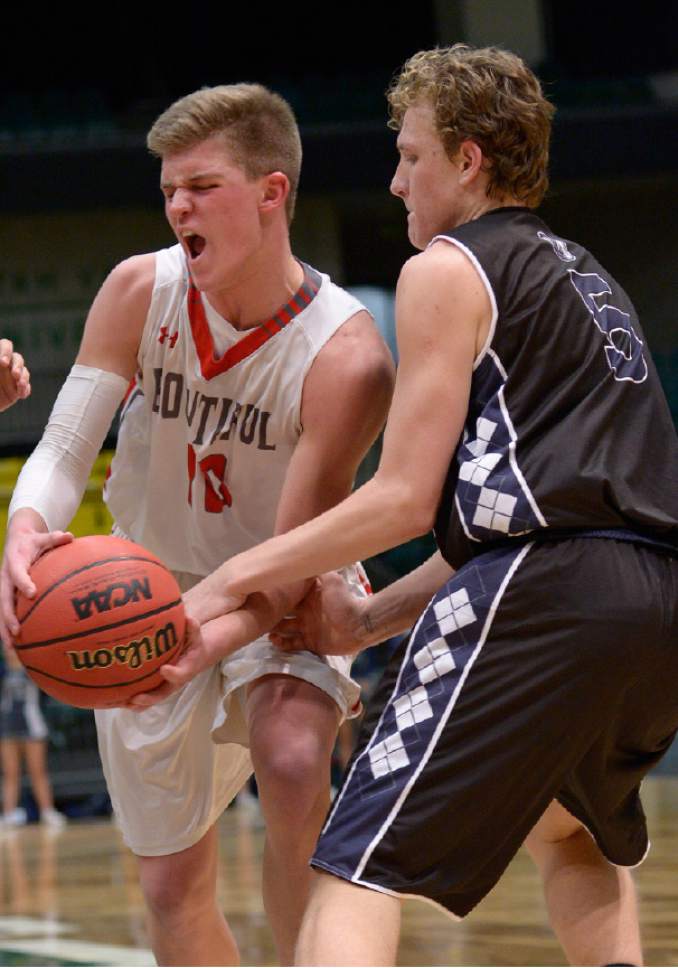 Leah Hogsten  |  The Salt Lake Tribune
Bountiful's Brig Willard is fouled by Corner Canyon's Michael Scheffner. Corner Canyon High School defeated Bountiful High School 62-42 during their 4A State boys' basketball playoff game at the UCCU Center on Utah Valley University's campus, Tuesday, February 28, 2017.