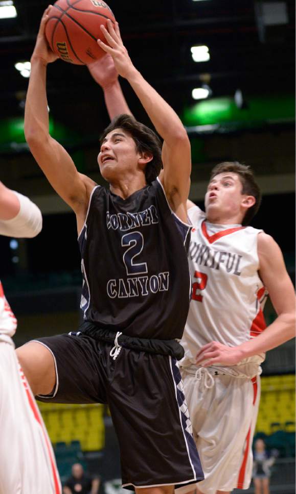 Leah Hogsten  |  The Salt Lake Tribune
Corner Canyon's John Mitchell is fouled by Bountiful's Camden Jones. 
Corner Canyon High School Bountiful High School during their 4A State boys' basketball playoff game at the UCCU Center on Utah Valley University's campus, Tuesday, February 28, 2017.