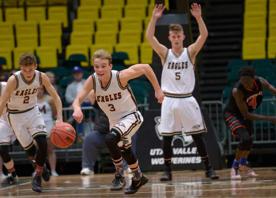 Leah Hogsten  |  The Salt Lake Tribune
Maple Mountain's Parker Christensen drives to the net for two after grabbing a turn over. Maple Mountain High School defeated Murray High School 78-47 during their 4A State boys' basketball playoff game at the UCCU Center on Utah Valley University's campus, Tuesday, February 28, 2017.