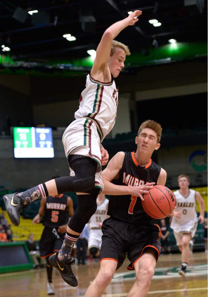 Leah Hogsten  |  The Salt Lake Tribune
Maple Mountain's Parker Christensen tries to block Murray's  Alec Vahn.  Maple Mountain High School defeated Murray High School 78-47 during their 4A State boys' basketball playoff game at the UCCU Center on Utah Valley University's campus, Tuesday, February 28, 2017.