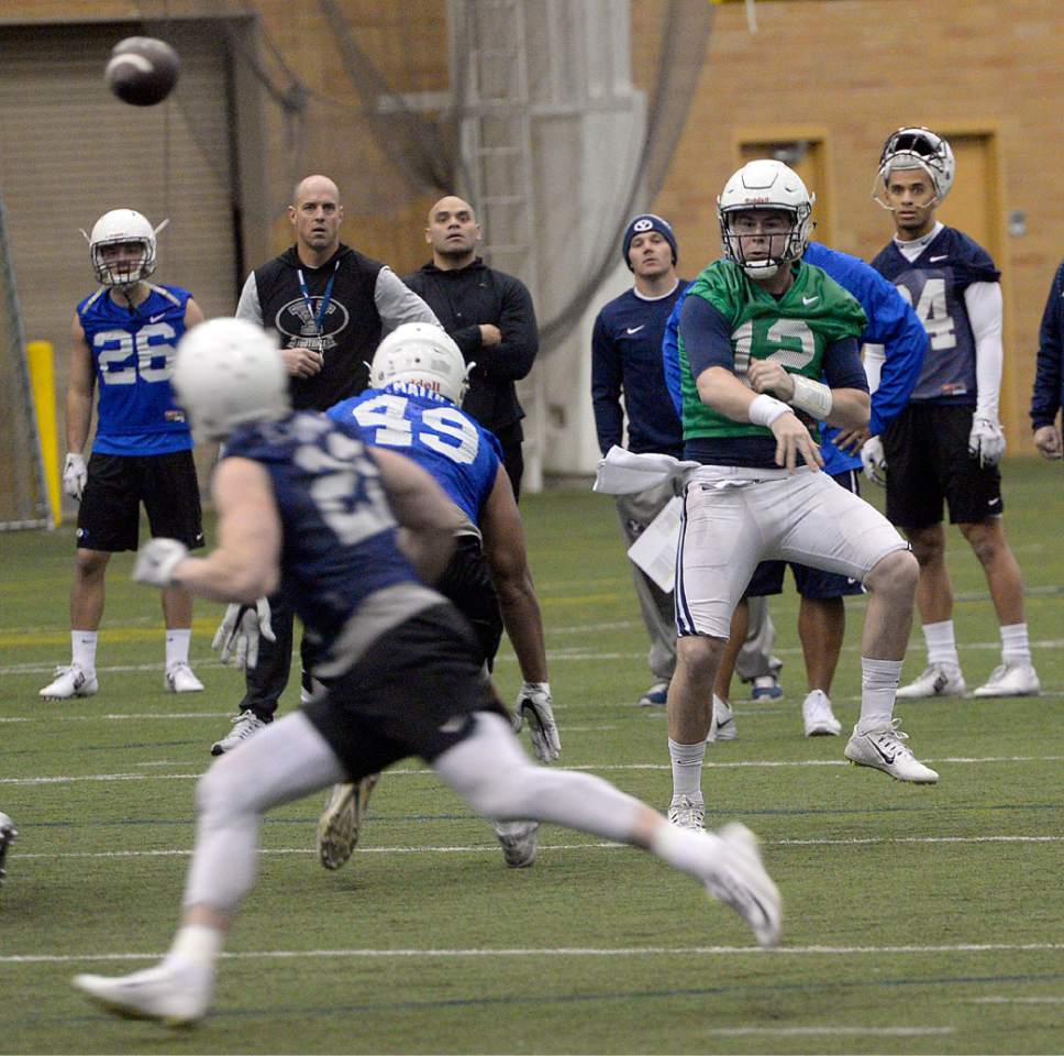 Al Hartmann  |  The Salt Lake Tribune
Starting quarterback Tanner Mangum takes a throw as BYU starts Spring training camp on Monday Feb. 27  at the Indoor Practice Facility.