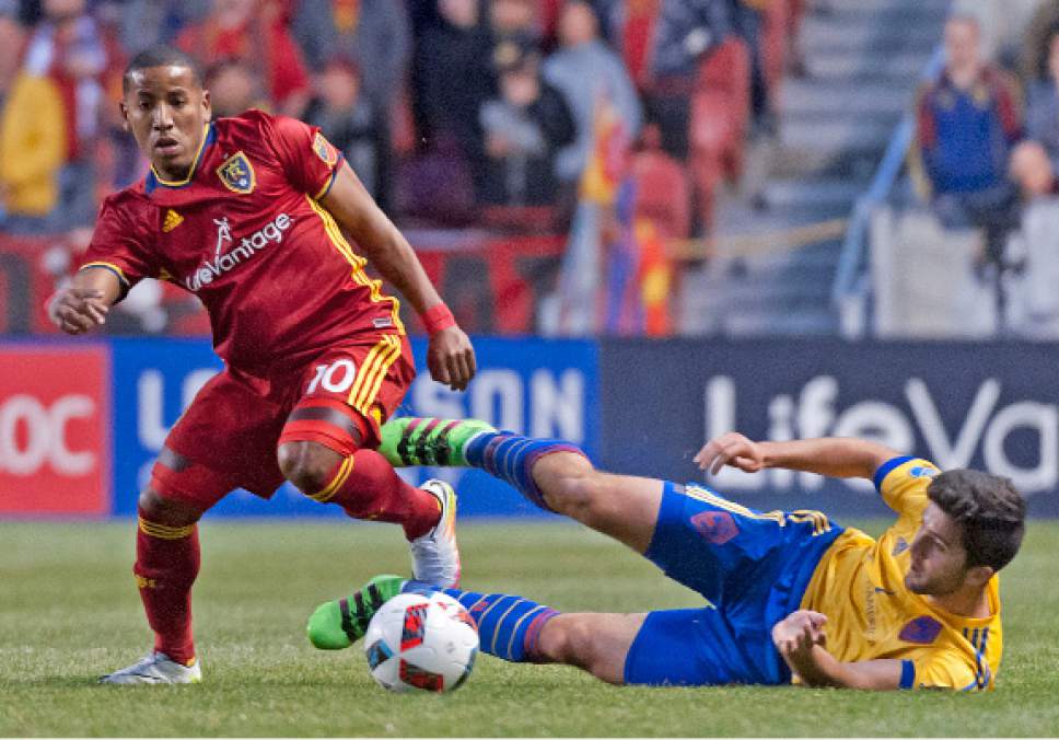 Michael Mangum  |  Special to the Tribune

Real Salt Lake forward Joao Plata (10) avoids a slide tackle from Colorado Rapids defender Eric Miller (3) during the first half their match at Rio Tinto Stadium in Sandy, UT on Saturday, April 9, 2016.