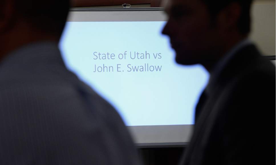 Scott Sommerdorf | The Salt Lake Tribune
The prosecution team stands in front of the beginning of a slide presentation entitled "State of Utah vs. John E. Swallow" prepared for closing arguments before the jury during former Utah Attorney General John Swallow's public corruption trial, Wednesday, March 1, 2017.