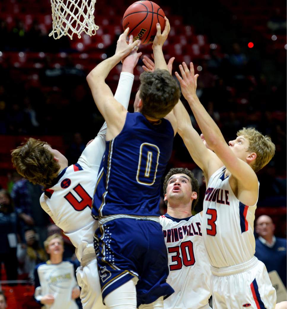 Steve Griffin  |  The Salt Lake Tribune


Skyline's Michael Vorwaller, center, tries to grab a rebound away from the Springville defense in the last seconds of the game during the 4A playoff at the Huntsman Center in Salt Lake City Tuesday February 28, 2017. Springville hung on for the victory.