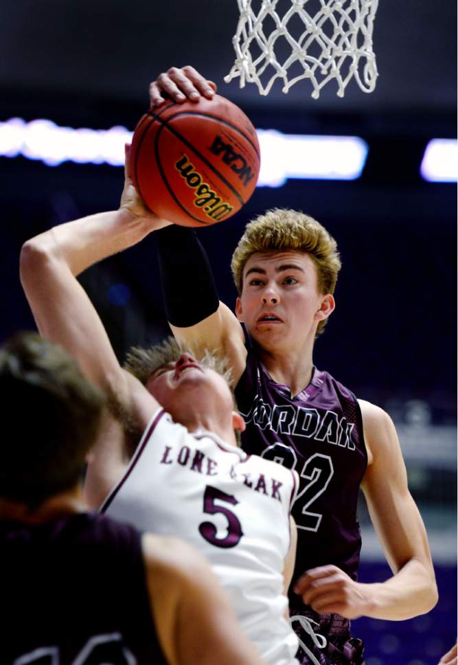 Steve Griffin  |  The Salt Lake Tribune


Jordan's Chandler Dean blocks the shot of Lone Peak's Max Brenchley during 5A playoff game at the Dee Events Center in Ogden Wednesday March 1, 2017.