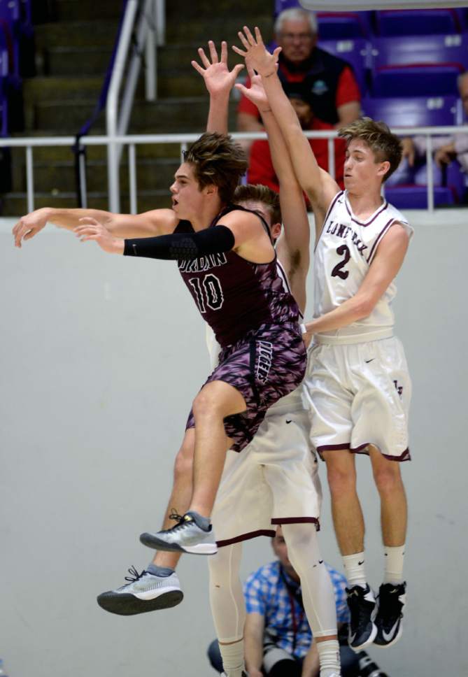 Steve Griffin  |  The Salt Lake Tribune


Jordan's Crew Wakley passes away from the Lone Peak defense during 5A playoff game at the Dee Events Center in Ogden Wednesday March 1, 2017.