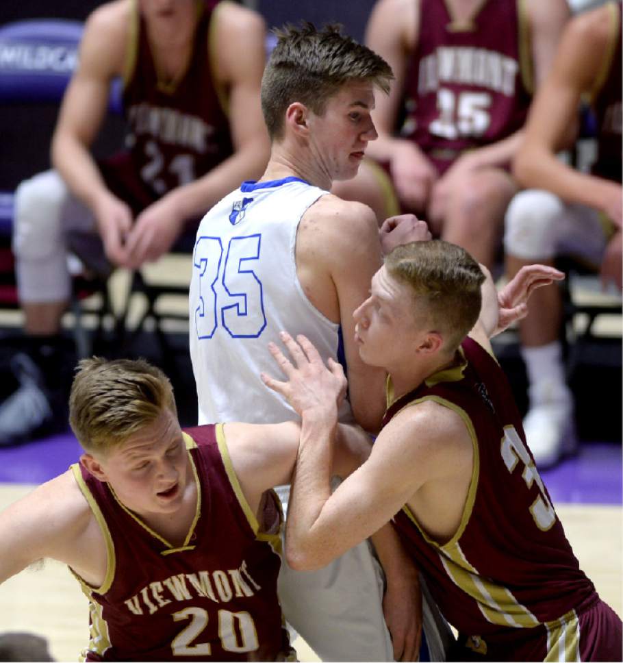 Steve Griffin  |  The Salt Lake Tribune


Viewmont's Spencer McKay and Adam Funk team up to box out Bingham's 6-11 center Branden Carlson during 5A playoff game at the Dee Events Center in Ogden Wednesday March 1, 2017.