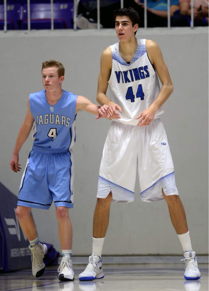 Steve Griffin  |  The Salt Lake Tribune


West Jordan's Randal Petersen tries to guard Pleasant Grove's 7-foot-3-inch center Matthew Van Komen during 5A playoff game between  and West Jordan at the Dee Events Center in Ogden Wednesday March 1, 2017.
