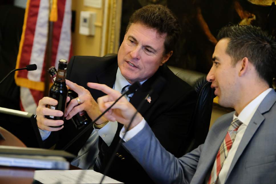 Francisco Kjolseth | The Salt Lake Tribune
Rep. James Dunnigan R-Taylorsville, left, and Rep. Marc Roberts, R-Salem, notice the small type that says  "contains alcohol," on flavored beer bottles passed out during the House Business and Labor Standing Committee at the State Capitol in Salt Lake City Wednesday, March 1, 2017.