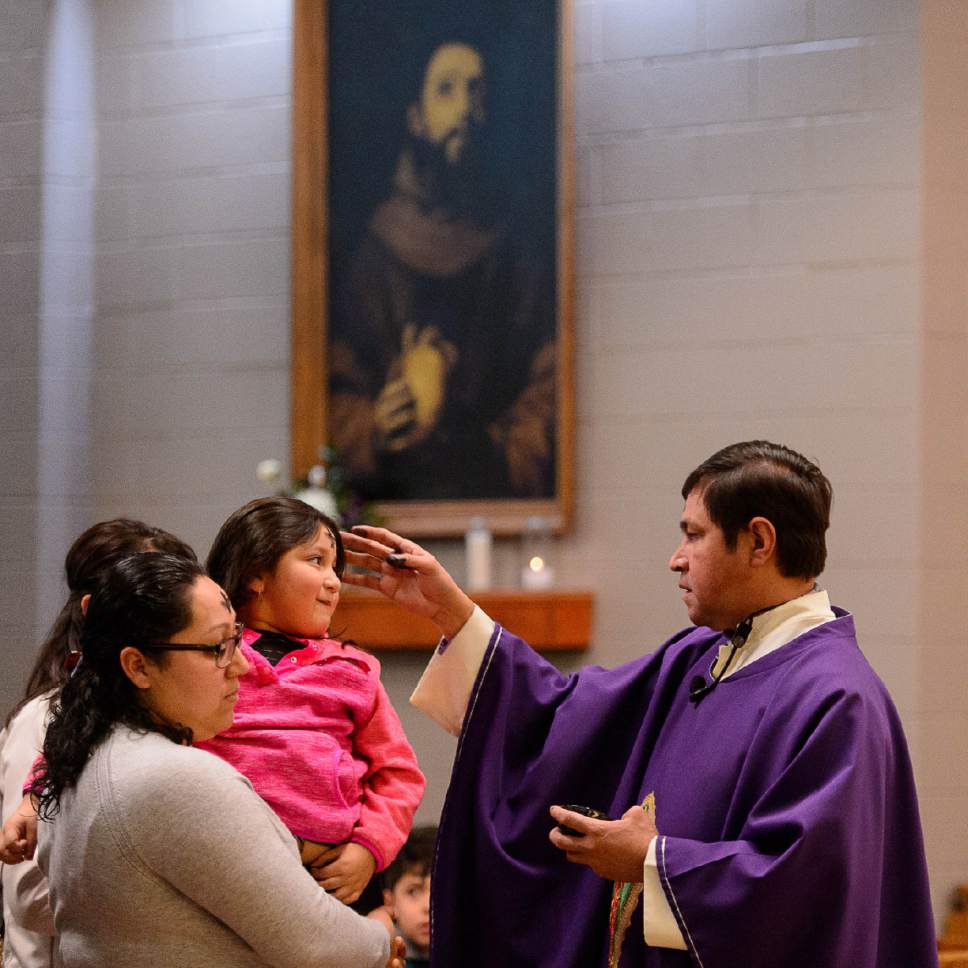 Trent Nelson  |  The Salt Lake Tribune
Father José Fidel Barrera-Cruz marks worshippers with ash during Ash Wednesday services at Our Lady of Guadalupe Church in Salt Lake City, Wednesday March 1, 2017.