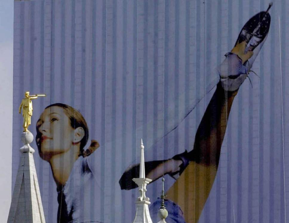 Tribune file photo

The image of a skater adorns the side of the 
LDS Church Office Building during the 2002 Winter Olympic Games.