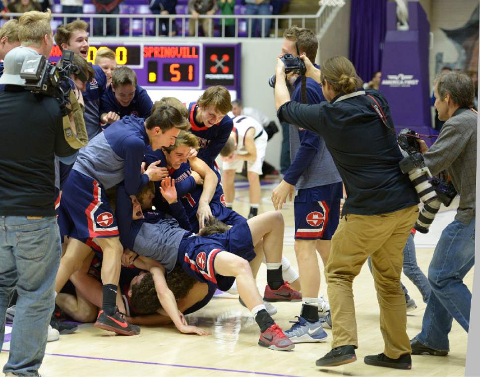 Leah Hogsten  |  The Salt Lake Tribune
Springville's bench exploded after Bennett Hullinger sunk a 3-point shot at the buzzer to clinch the win. Springville High School defeated Woods Cross High School 51-50 at the buzzer during their 4A State boys' basketball quarterfinal playoff game at Weber State University's Dee Events Center, Thursday, March 2, 2017.